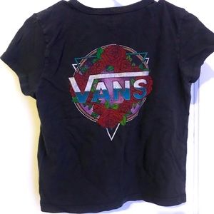 Small, black Vans t-shirt. Large colorful logo on back.